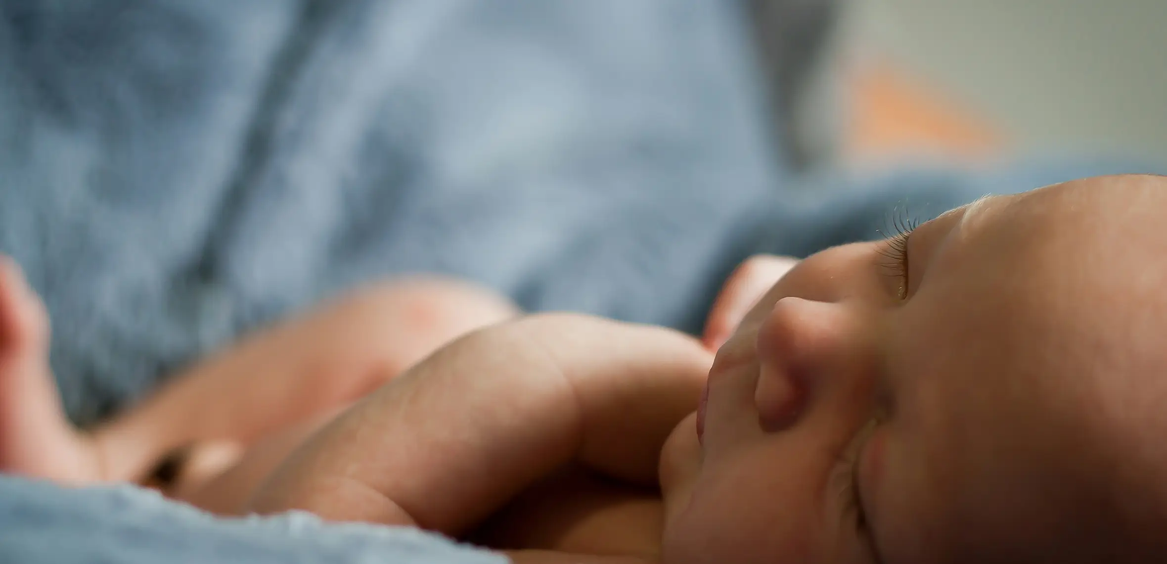 Baby sleeping on blue blanket