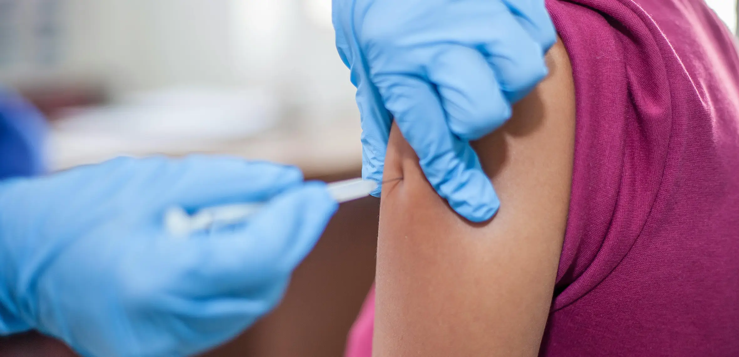 Doctor administering a flu vaccination